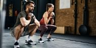 Partner workout of the day (Image via Getty Images)